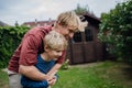 Father embracing his young son, having bonding moment. Concept of Father's Day, and fatherly love. Royalty Free Stock Photo