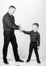 Father example of noble human. Cool guys. Father little son red shirts family look outfit. Best friends forever Royalty Free Stock Photo