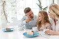 father feeding his daughter with cake while they spending time Royalty Free Stock Photo