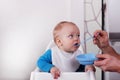 Father feeding his little adorable son Royalty Free Stock Photo