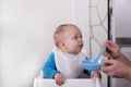 Father feeding his little delightful son Royalty Free Stock Photo