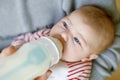 Father feeding newborn baby daughter with milk in nursing bottle Royalty Free Stock Photo