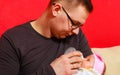 Father feeding newborn baby girl with milk bottle Royalty Free Stock Photo