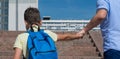 Father forcefully takes his son to school, up the stairs Royalty Free Stock Photo