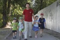 Father walks on the street with his childs on father`s day Royalty Free Stock Photo