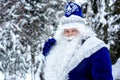 Father Frost with a bag of gifts in the woods, among the snowy trees. Winter, Russian Christmas characters Ded Moroz Royalty Free Stock Photo