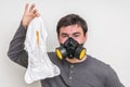 Father with gas mask changing smelly diaper Royalty Free Stock Photo