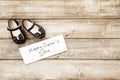 Father and girl brown shoes on wooden background, fathers day Royalty Free Stock Photo