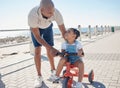 Father, girl child and tricycle at park, learning and happy in ocean sunshine on family vacation. Dad, daughter and Royalty Free Stock Photo