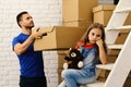 Father and girl with sad or bored face. Moving in