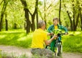 Father gives his son a bicycle helmet