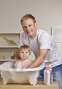 Father Giving Daughter a Bath Royalty Free Stock Photo