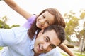 Father Giving Daughter Piggyback Ride In Garden Royalty Free Stock Photo