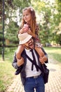 Father giving daughter piggyback ride Royalty Free Stock Photo