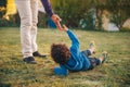 Father giving a helping hand to his son Royalty Free Stock Photo