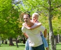 Father giving his daughter piggy-back ride Royalty Free Stock Photo