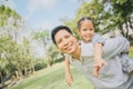 Father giving his daughter a piggyback Royalty Free Stock Photo