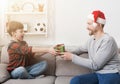 Father giving his son a christmas present at home Royalty Free Stock Photo