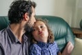 Father giving his son a kiss on the forhead Royalty Free Stock Photo