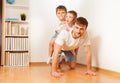 Father giving his two sons piggy back ride Royalty Free Stock Photo