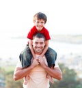 Father giving son piggyback ride