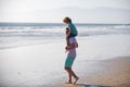 Father giving son ride on back outside. Dad and child enjoying outdoor. Little boy kid with daddy carrying him on Royalty Free Stock Photo