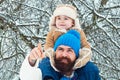 Father giving son ride on back in park. Child sits on the shoulders of his father. Portrait of happy father giving son Royalty Free Stock Photo