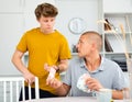 Father giving son money Royalty Free Stock Photo