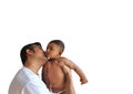 A father in glasses kissing a little boy on his lap in white background Royalty Free Stock Photo