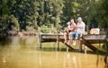 Father, grandfather and child fishing at lake together for fun bonding or peaceful time in nature outdoors. Dad, grandpa Royalty Free Stock Photo