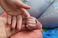 Father hand in hand with baby Royalty Free Stock Photo