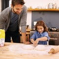 Father, happy and child hands baking, helping and dough with flour on counter table, parent and kid together and smile Royalty Free Stock Photo