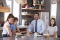 Father Having Family Breakfast In Kitchen Before Leaving For Work Royalty Free Stock Photo