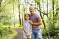 Father having fun in forest with his daughter Royalty Free Stock Photo