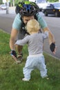 Father hedging their baby, toddler learning to walk Royalty Free Stock Photo