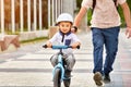 Father help his son ride a bicycle Royalty Free Stock Photo