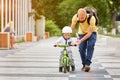 Father help his son ride a bicycle Royalty Free Stock Photo