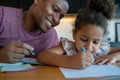 A father helping his daughter with homeschool. Royalty Free Stock Photo