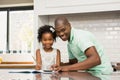 Father helping his daughter with homework Royalty Free Stock Photo