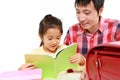 Father helping his daugther doing homework Royalty Free Stock Photo