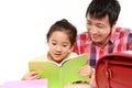 Father helping his daugther doing homework Royalty Free Stock Photo