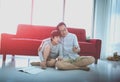 Father helping his son doing homework on Mobile online education at home using smart phone Royalty Free Stock Photo