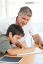 Father helping his son with his homework Royalty Free Stock Photo