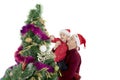 Father helping his son to decorate Christmas tree Royalty Free Stock Photo