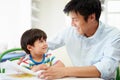 Father Helping Son With Homework Royalty Free Stock Photo