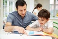 Father Helping Son With Homework Royalty Free Stock Photo