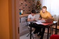 Father helping son to do homework Royalty Free Stock Photo