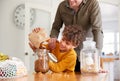 Father Helping Son To Refill Food Containers At Home Using Zero Waste Packaging Royalty Free Stock Photo
