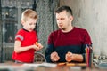 The father helps his son to do homework for the school Royalty Free Stock Photo