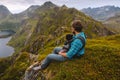 Father hiking with baby in mountains active family vacations man traveling with child walking together outdoor